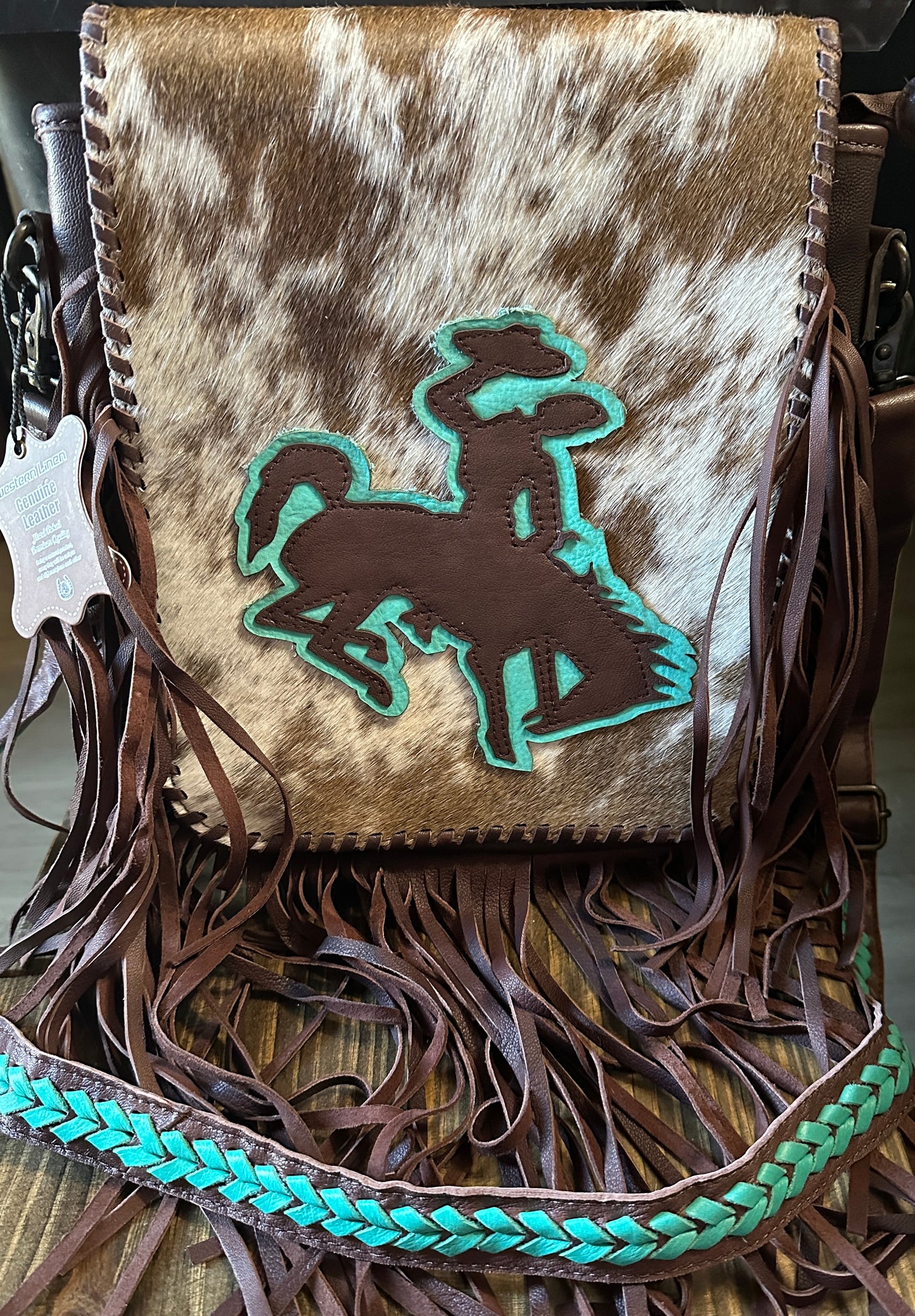 WL cowhide, bronc rider purse